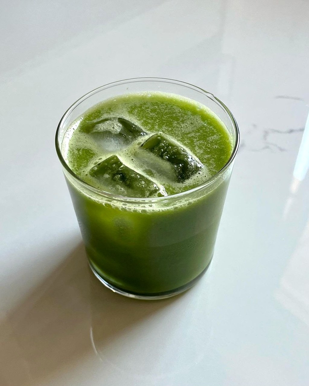 Crisp green apple pineapple juice served over ice